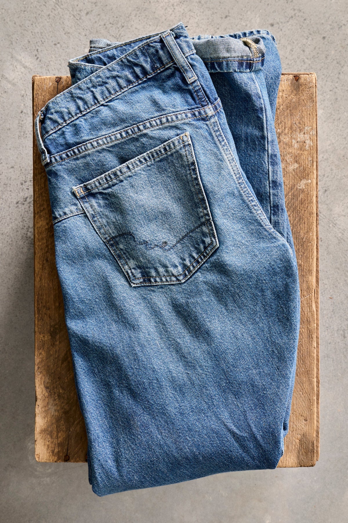 Free People Fable Low-Rise Twisted Bowed Jeans - Heartsong, denim wash detail