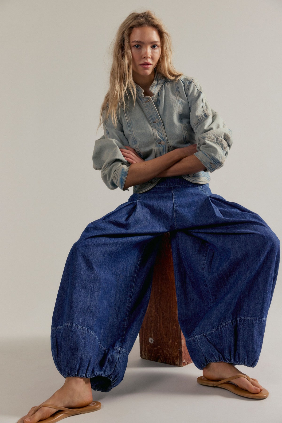 Free People Moonflower Pull-On Balloon Jeans - Blue Dusk, seated styling view